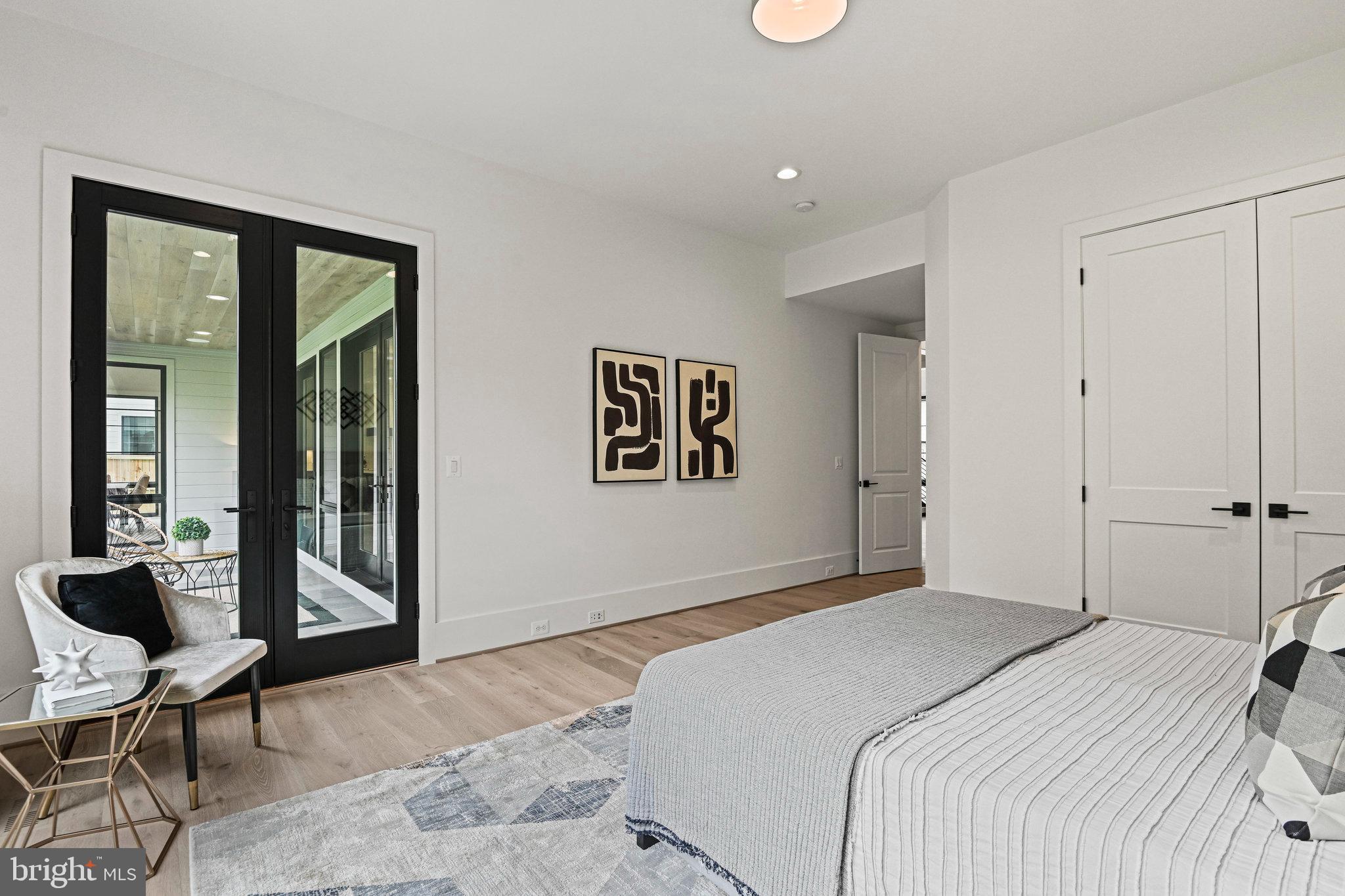 1109 Ingleside Avenue McLean, VA 22101 - Photo 26 of 94 a bedroom with a bed and glass walk in closet