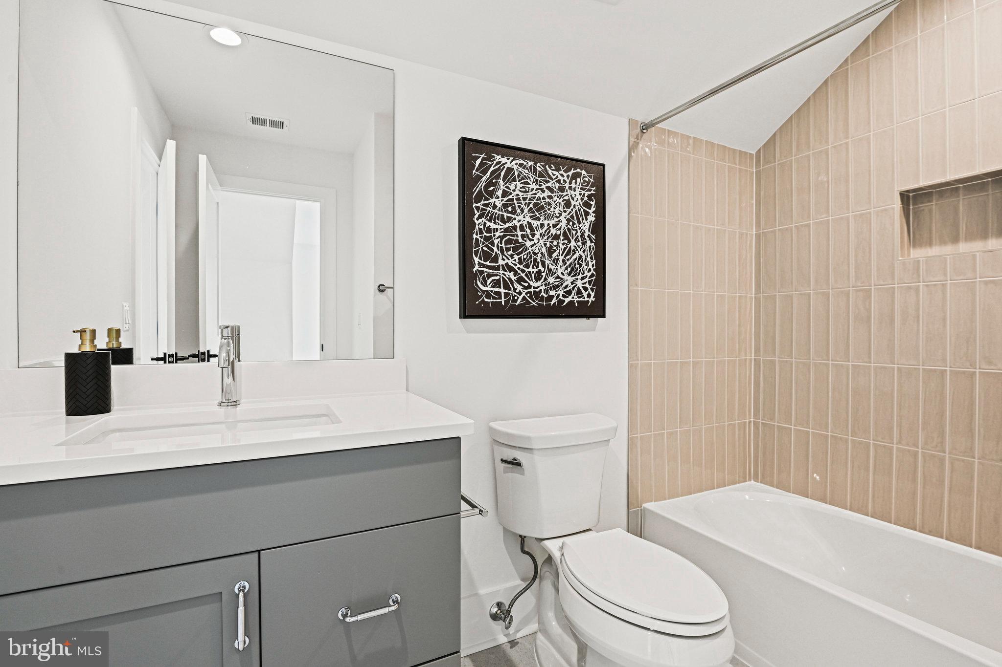 1109 Ingleside Avenue McLean, VA 22101 - Photo 69 of 94 a bathroom with a sink a toilet and shower