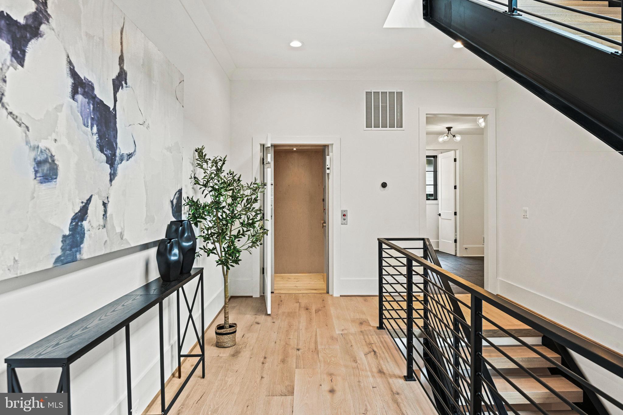 1109 Ingleside Avenue McLean, VA 22101 - Photo 7 of 94 a view of a hallway with wooden floor and staircase