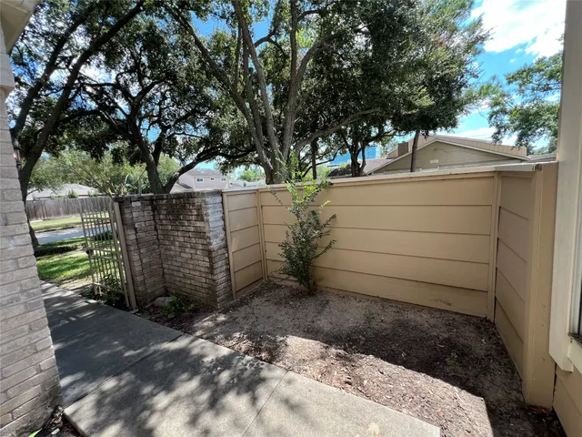 a view of a backyard of the house
