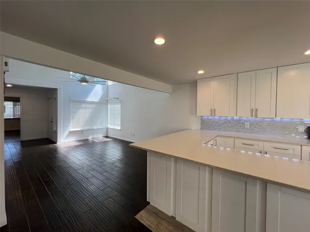 a view of a kitchen with a sink and a microwave