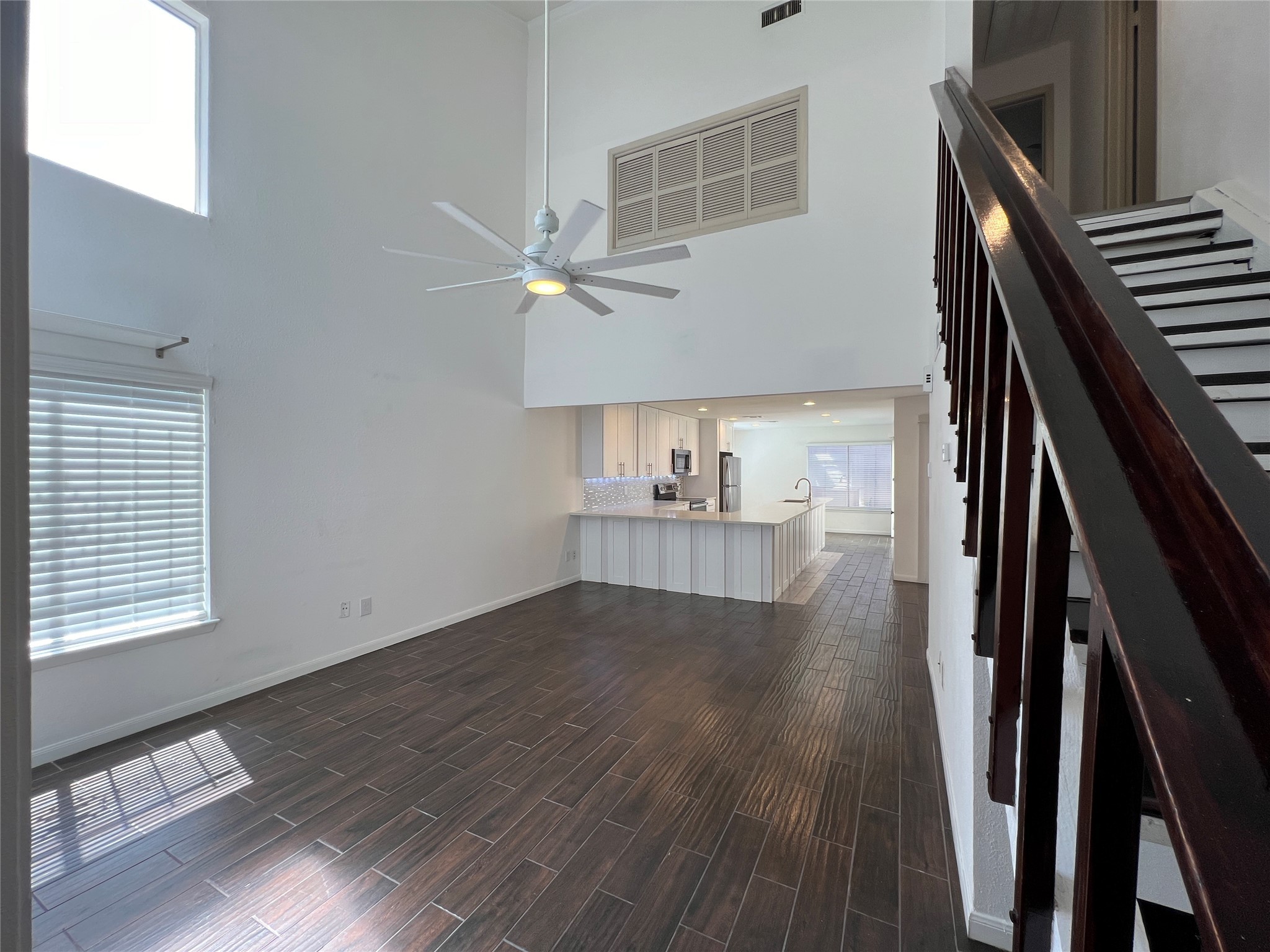 2372 Woodland Park Drive, Unit 121 Houston, TX 77077 - Photo 14 of 47 a view of an empty room with wooden floor and a window