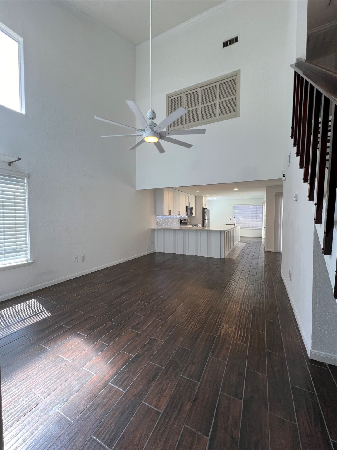 2372 Woodland Park Drive, Unit 121 Houston, TX 77077 - Photo 20 of 47 an empty room with wooden floor and staircase