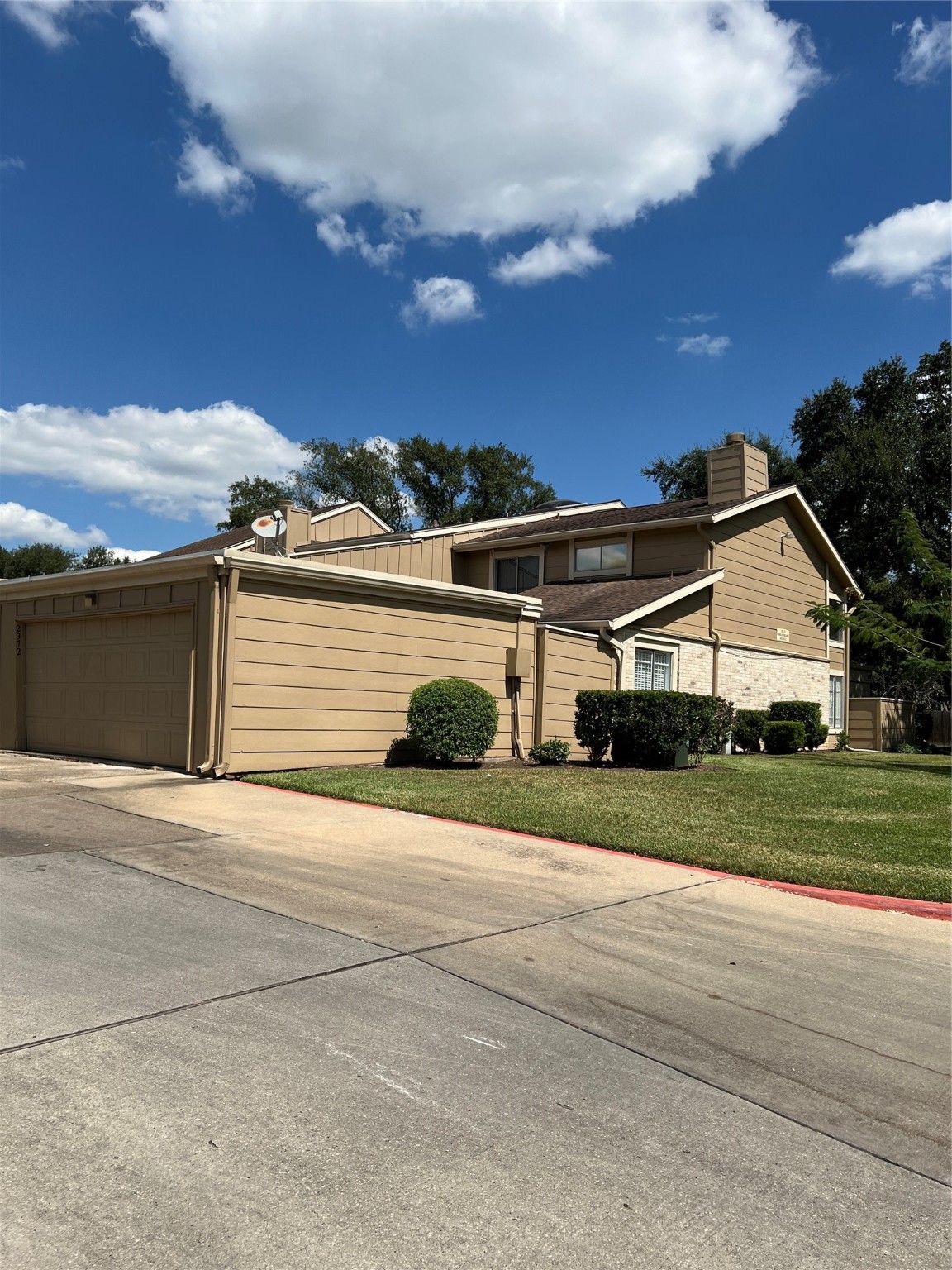 2372 Woodland Park Drive, Unit 121 Houston, TX 77077 - Photo 2 of 47 front view of a house with a yard
