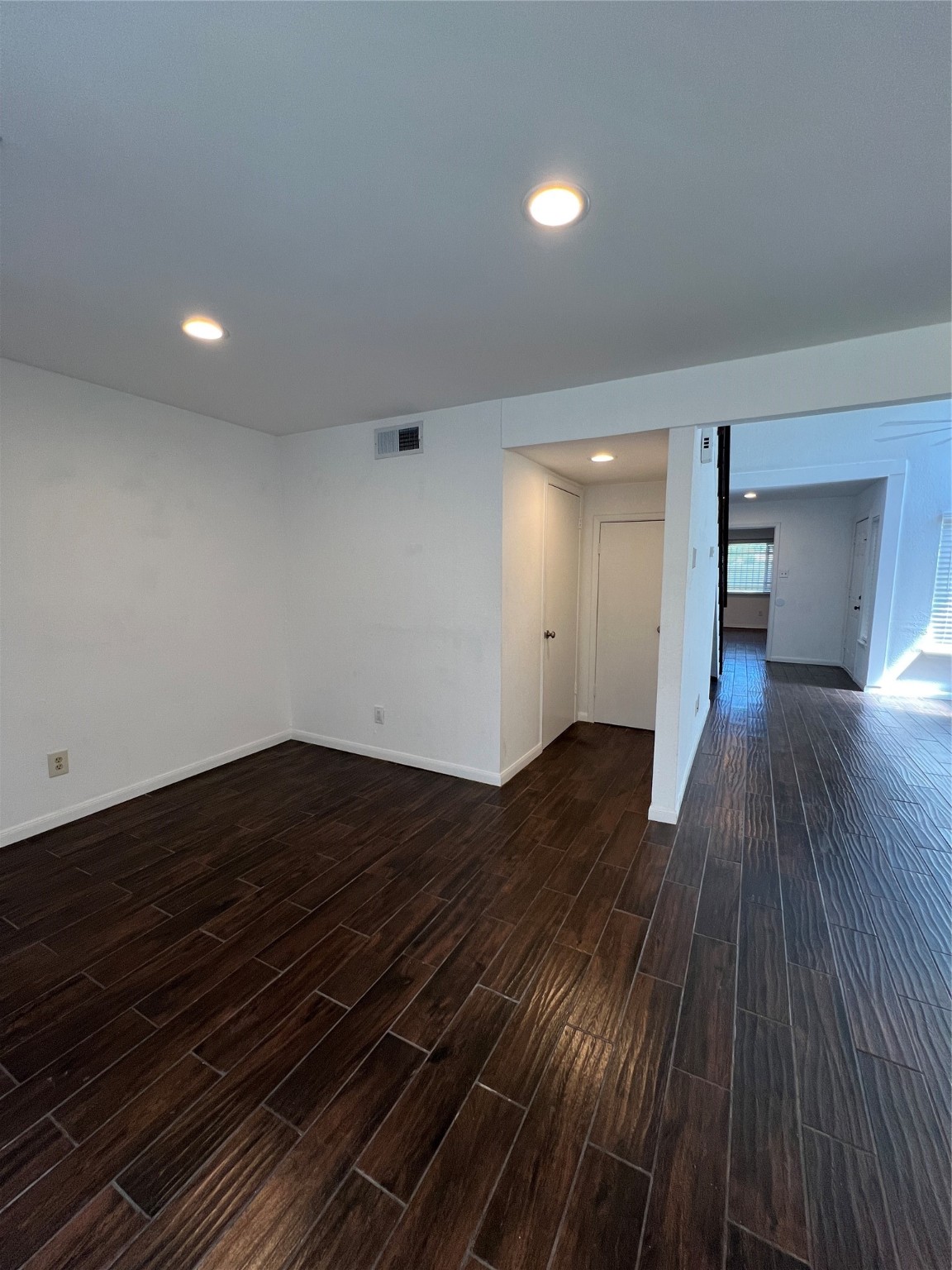 2372 Woodland Park Drive, Unit 121 Houston, TX 77077 - Photo 21 of 47 a view of empty room with wooden floor