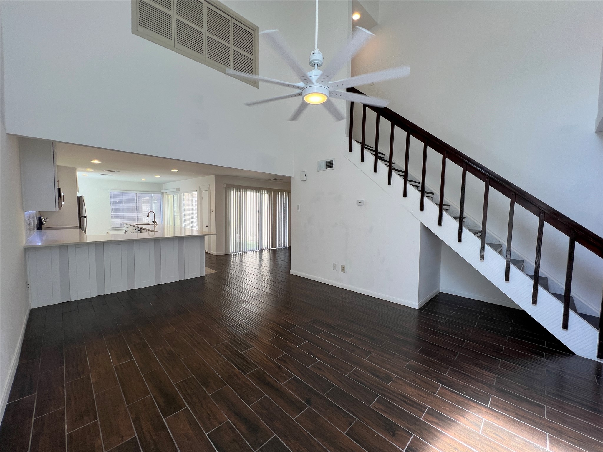2372 Woodland Park Drive, Unit 121 Houston, TX 77077 - Photo 22 of 47 a view of an entryway with wooden floor and staircase