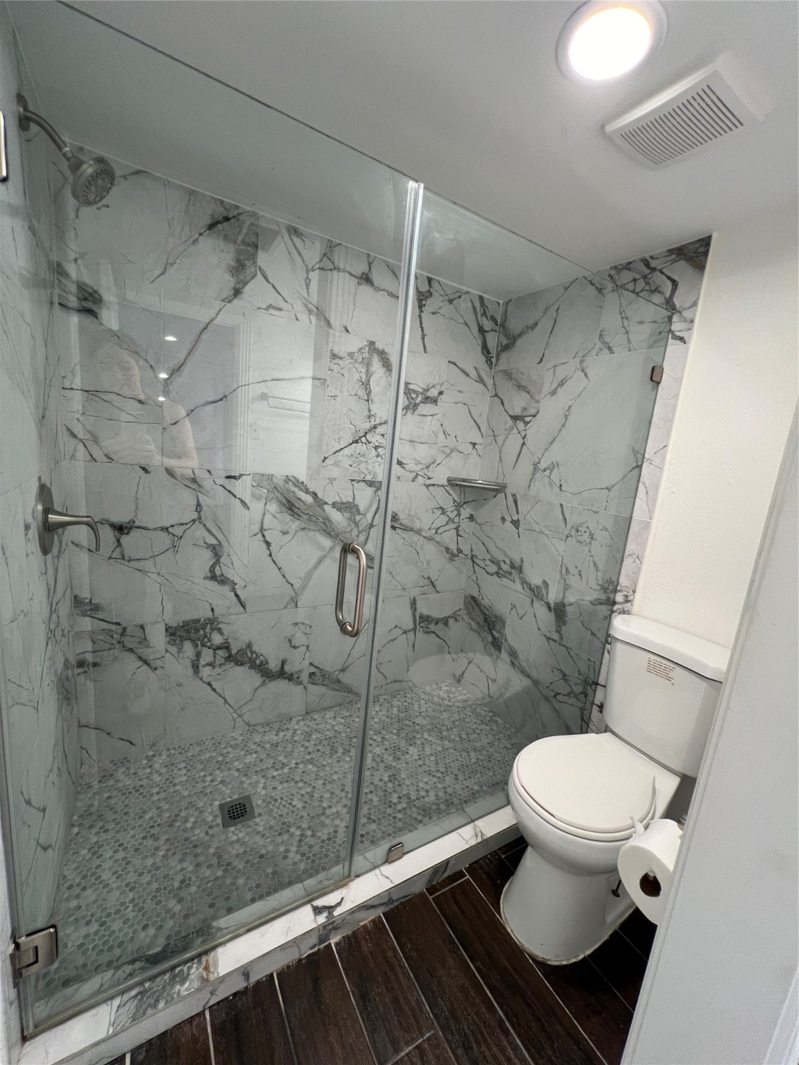 2372 Woodland Park Drive, Unit 121 Houston, TX 77077 - Photo 30 of 47 a bathroom with a toilet and a shower