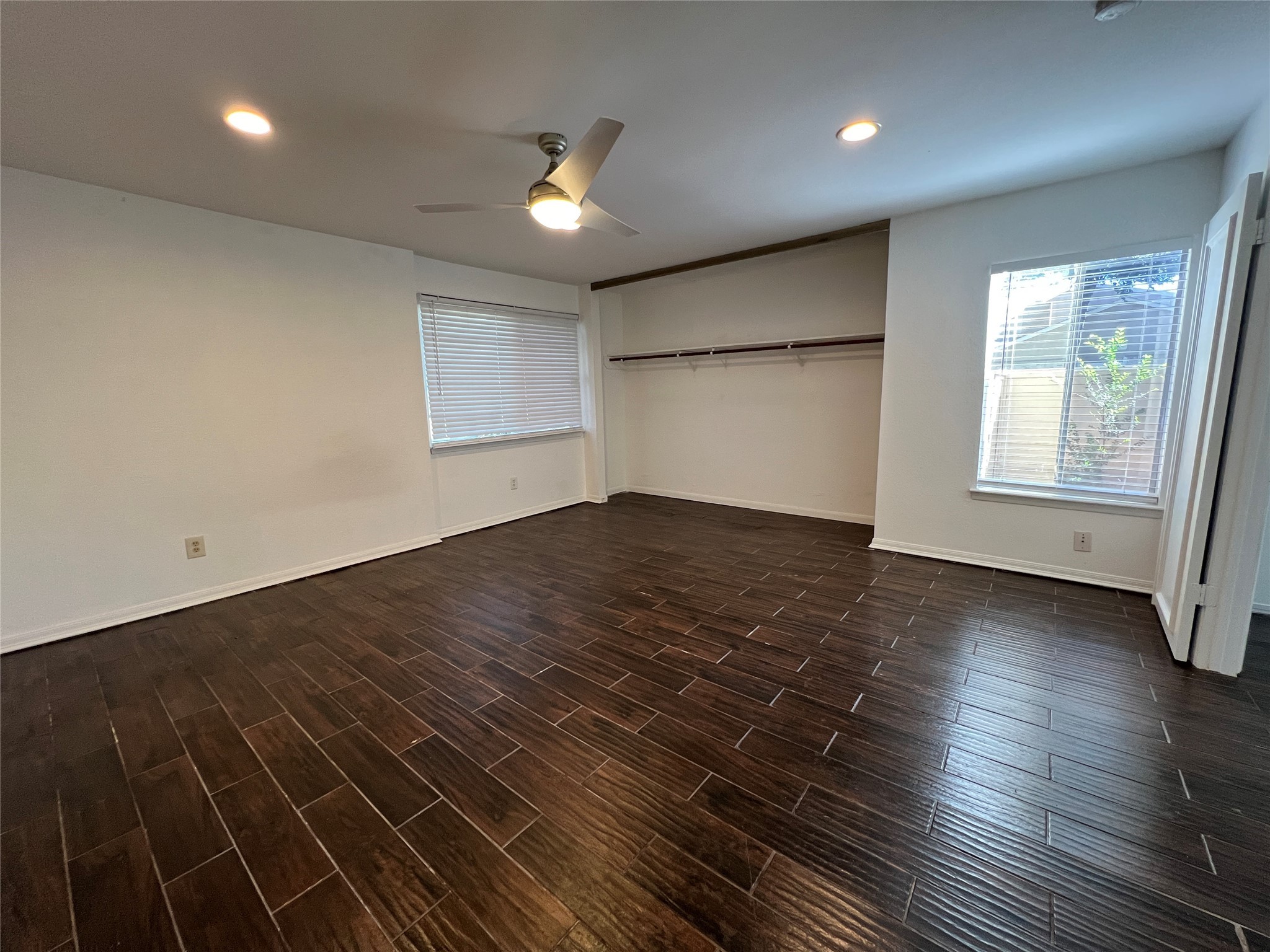 2372 Woodland Park Drive, Unit 121 Houston, TX 77077 - Photo 38 of 47 an empty room with wooden floor and windows