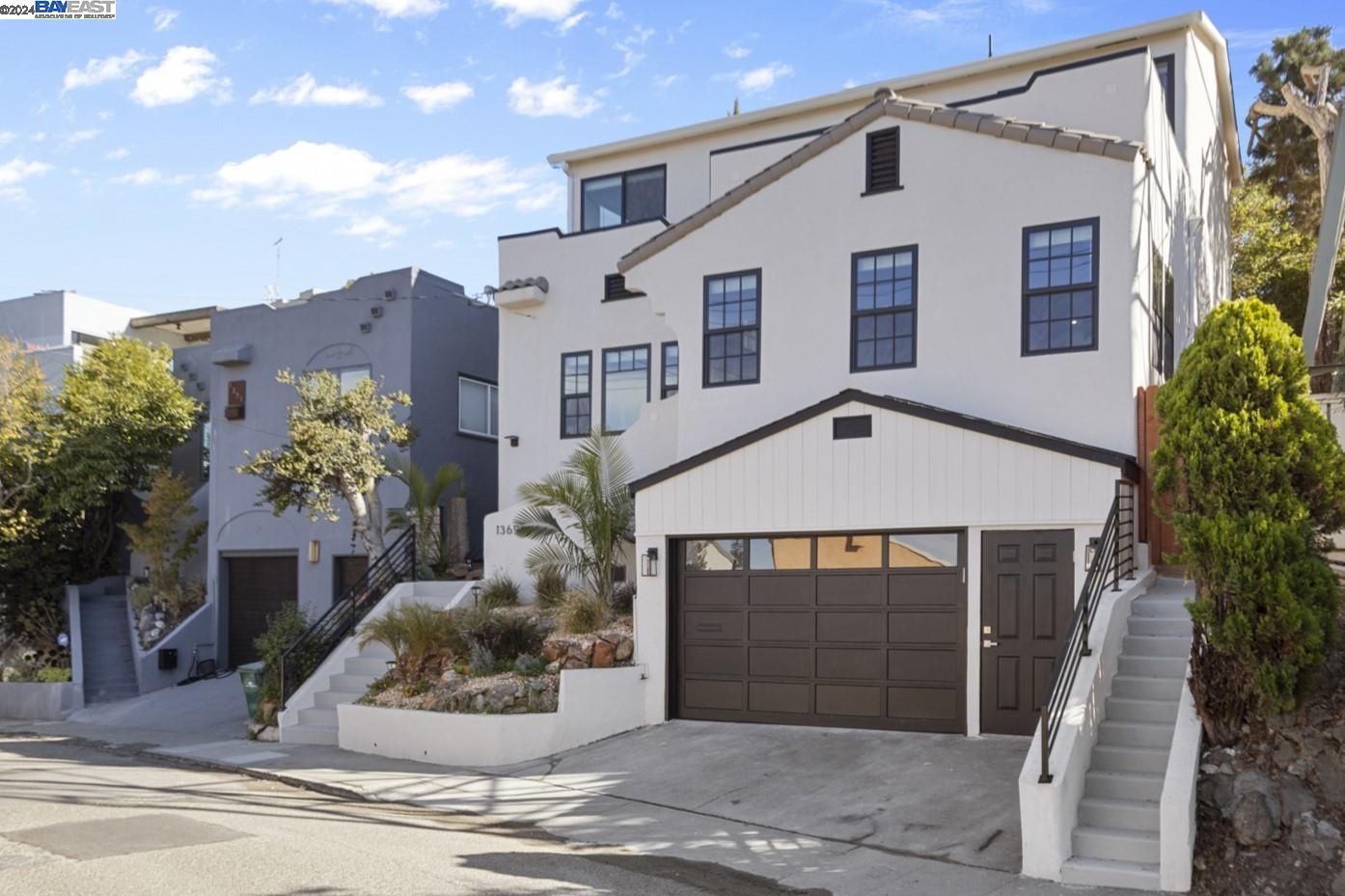 a front view of a house with a garage