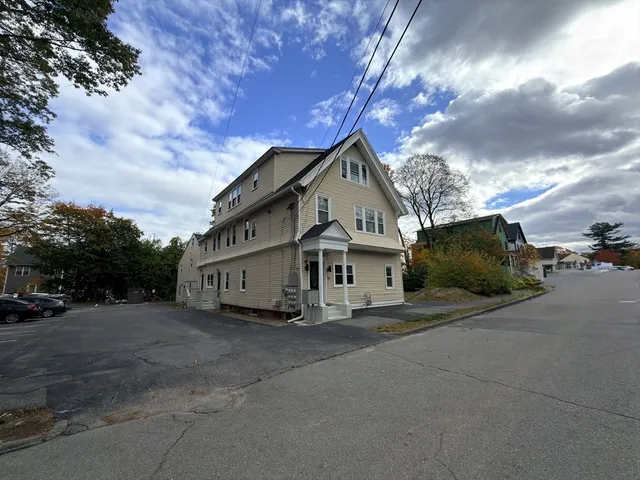 a view of a house with a yard