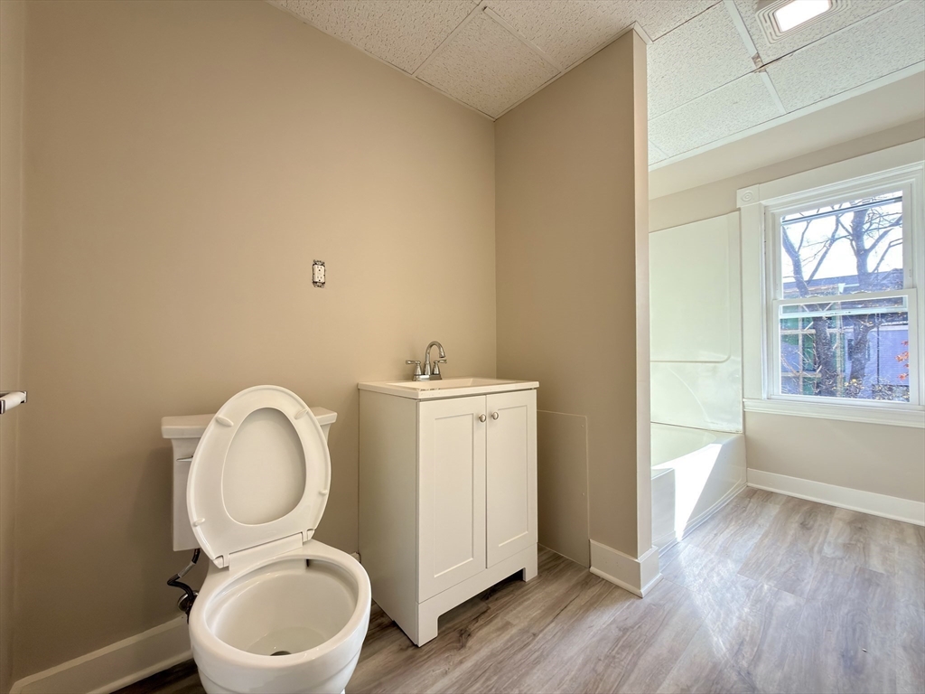 91 Alvarado Avenue, Unit 8 Worcester, MA 01604 - Photo 13 of 26 a bathroom with a toilet a sink and a mirror