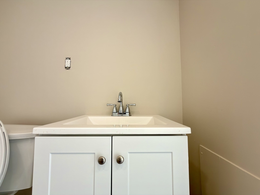 91 Alvarado Avenue, Unit 8 Worcester, MA 01604 - Photo 14 of 26 a utility room with a sink a vanity and a mirror