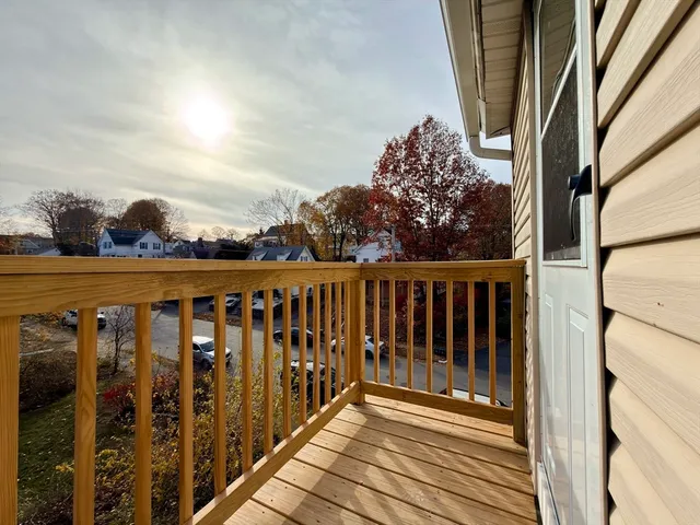 a view of a balcony with wooden fence