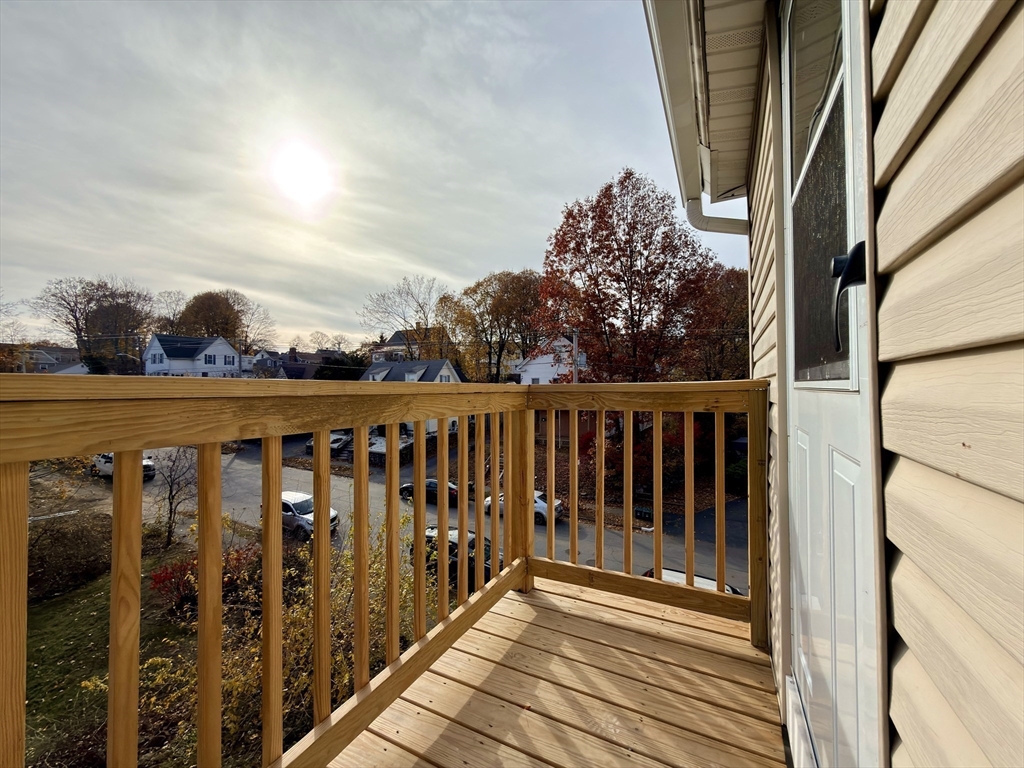 91 Alvarado Avenue, Unit 8 Worcester, MA 01604 - Photo 2 of 26 a view of a balcony with wooden fence