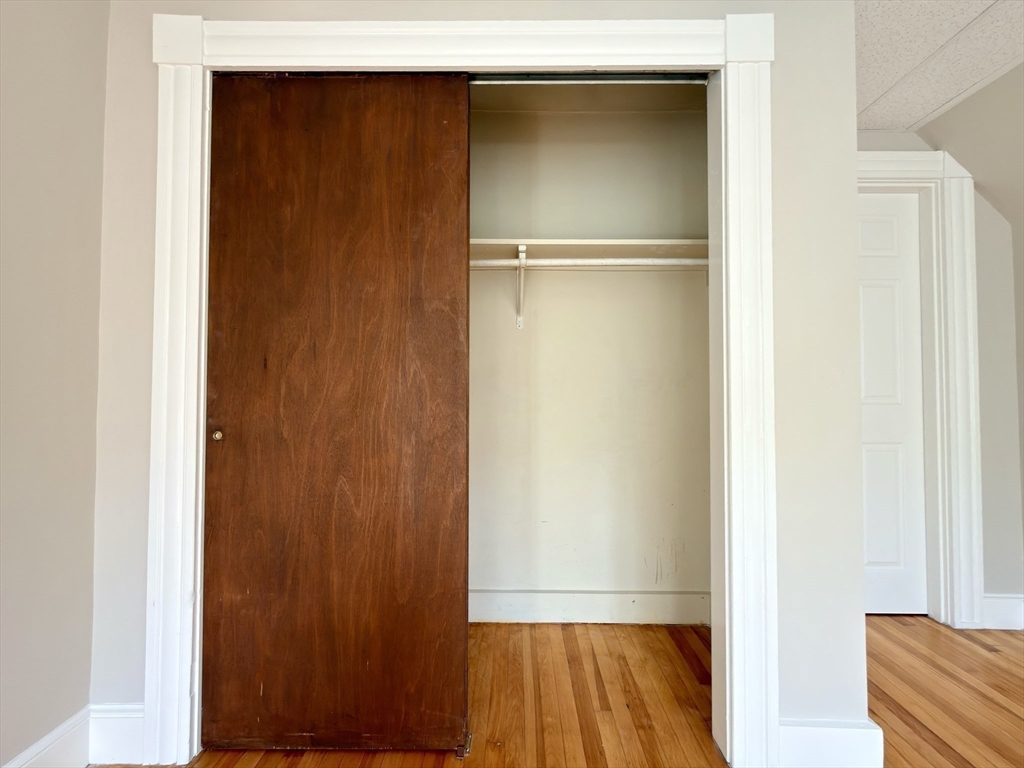 91 Alvarado Avenue, Unit 8 Worcester, MA 01604 - Photo 25 of 26 a view of walk in closet with wooden floor
