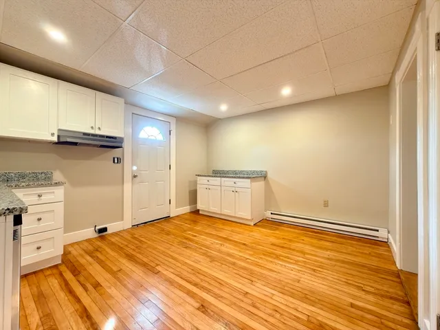 a view of a kitchen with wooden floor