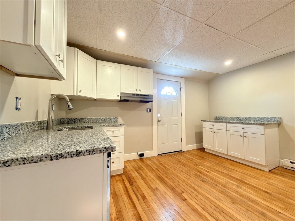 91 Alvarado Avenue, Unit 8 Worcester, MA 01604 - Photo 10 of 26 a large kitchen with stainless steel appliances granite countertop a sink a stove counter space and cabinets