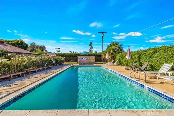 a view of a swimming pool with a patio