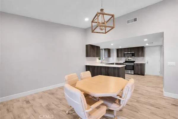 a view of kitchen with cabinets and wooden floor