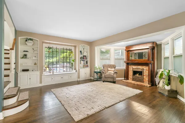 a living room with furniture and a fireplace