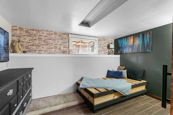 a living room with furniture and wall paintings