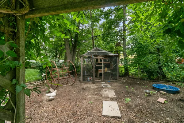 a backyard of a house with table and chairs