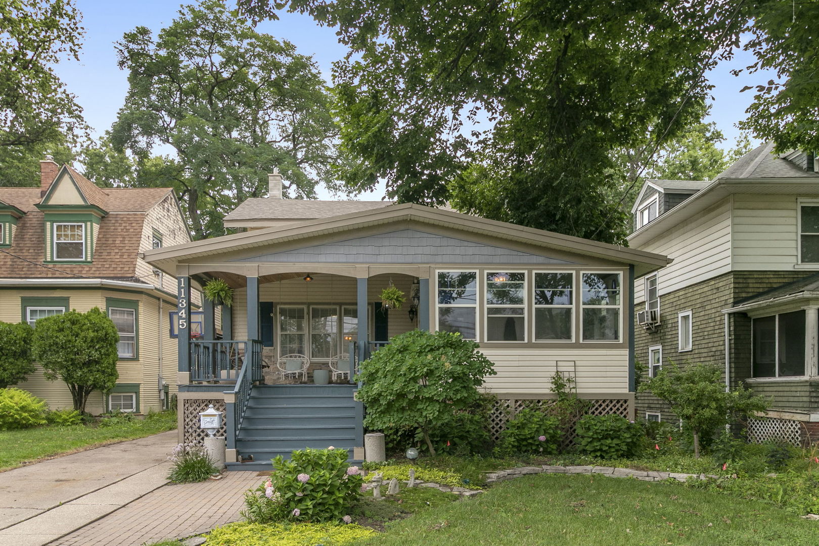 11345 South Bell Avenue Chicago, IL 60643 - Photo 28 of 28 a front view of a house with a yard