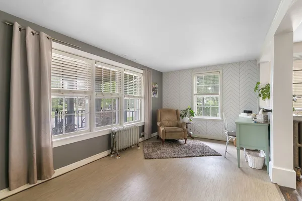 a living room with furniture and windows