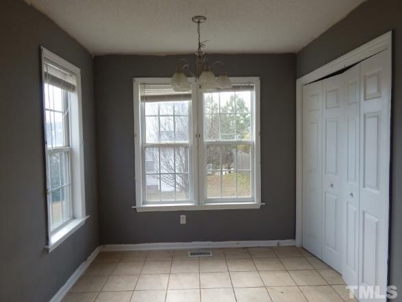 4713 Windbreak Lane Raleigh, NC 27616 - Photo 4 of 6 a view of an empty room with a window