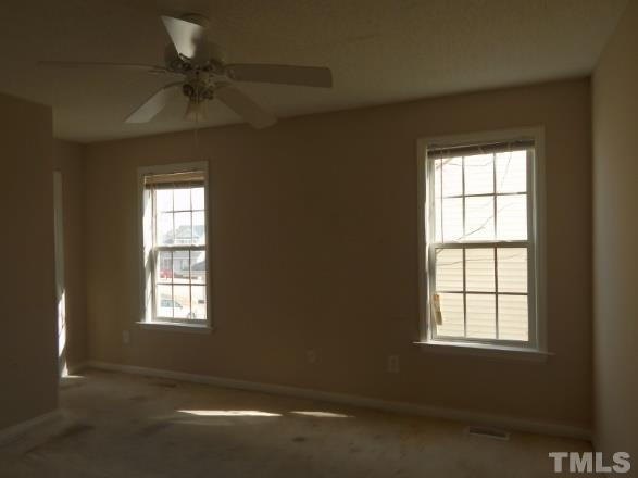 4713 Windbreak Lane Raleigh, NC 27616 - Photo 5 of 6 an empty room with windows