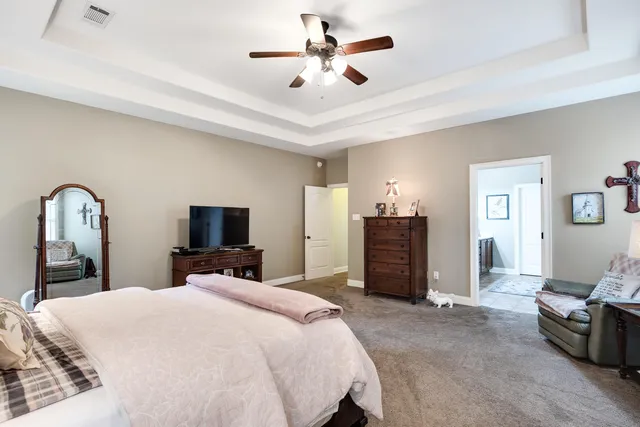 a bedroom with a bed and a television