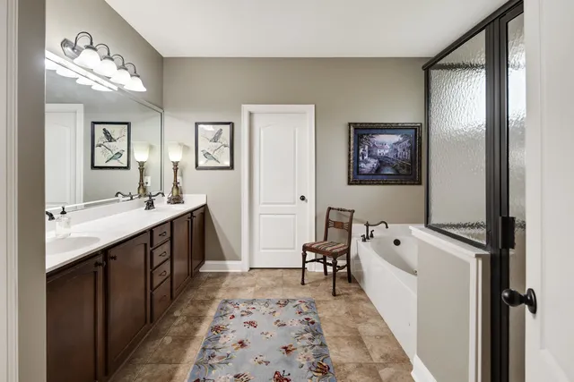 a bathroom with a sink a mirror and a toilet