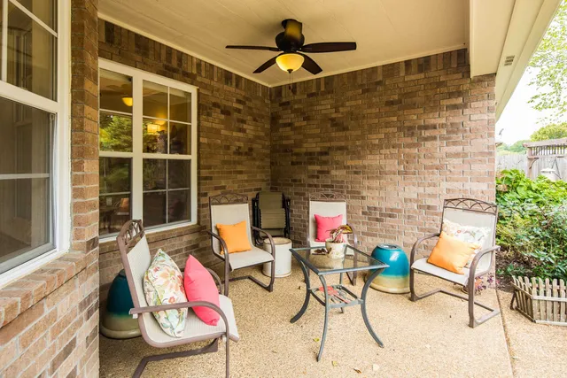 a backyard of a house with seating space