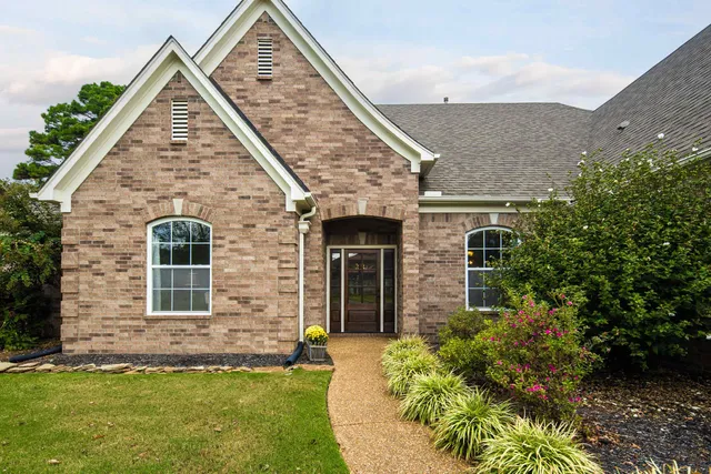 front view of a house with a yard