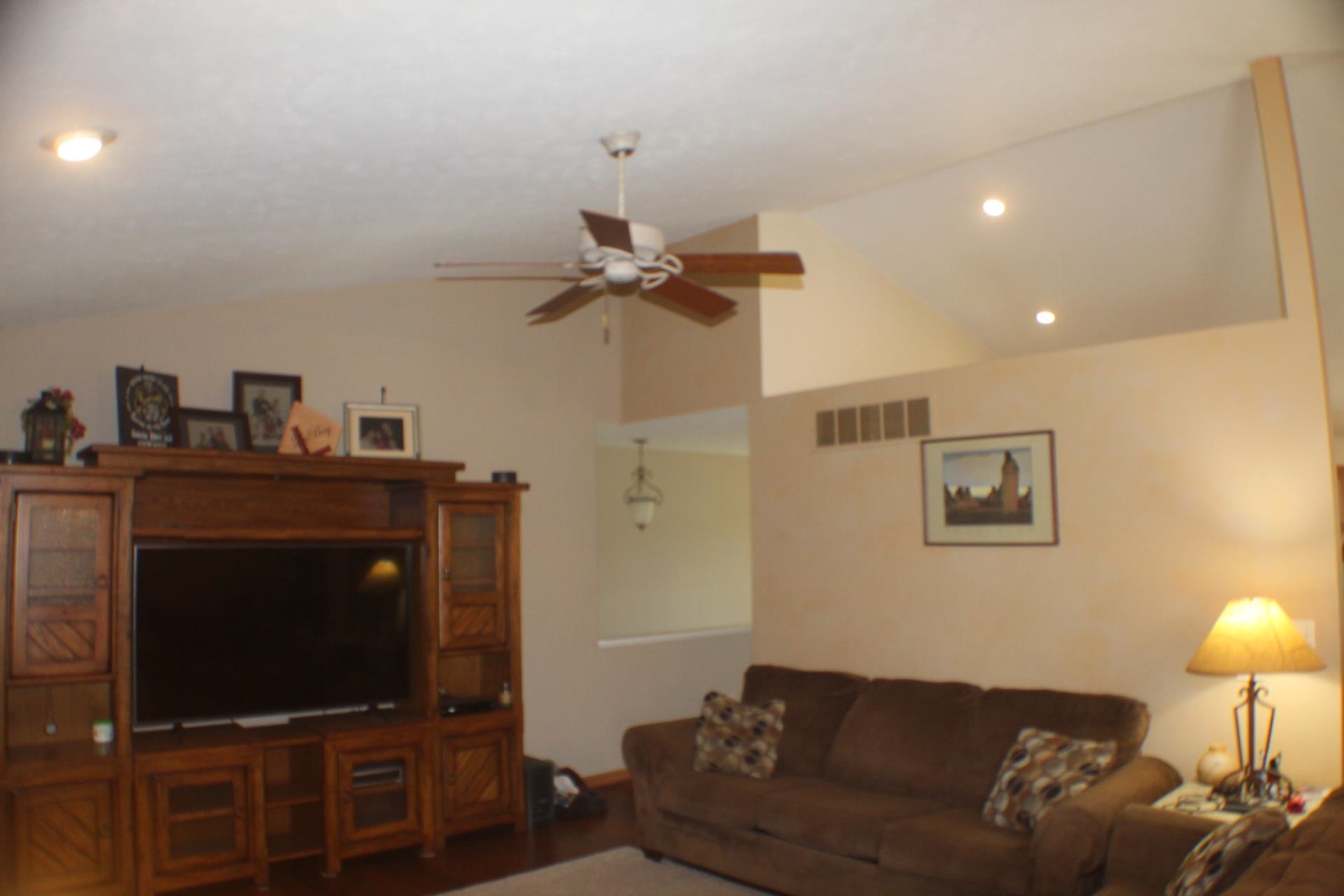 9190 North Barker Road Byron, IL 61010 - Photo 12 of 53 a living room with furniture and a flat screen tv