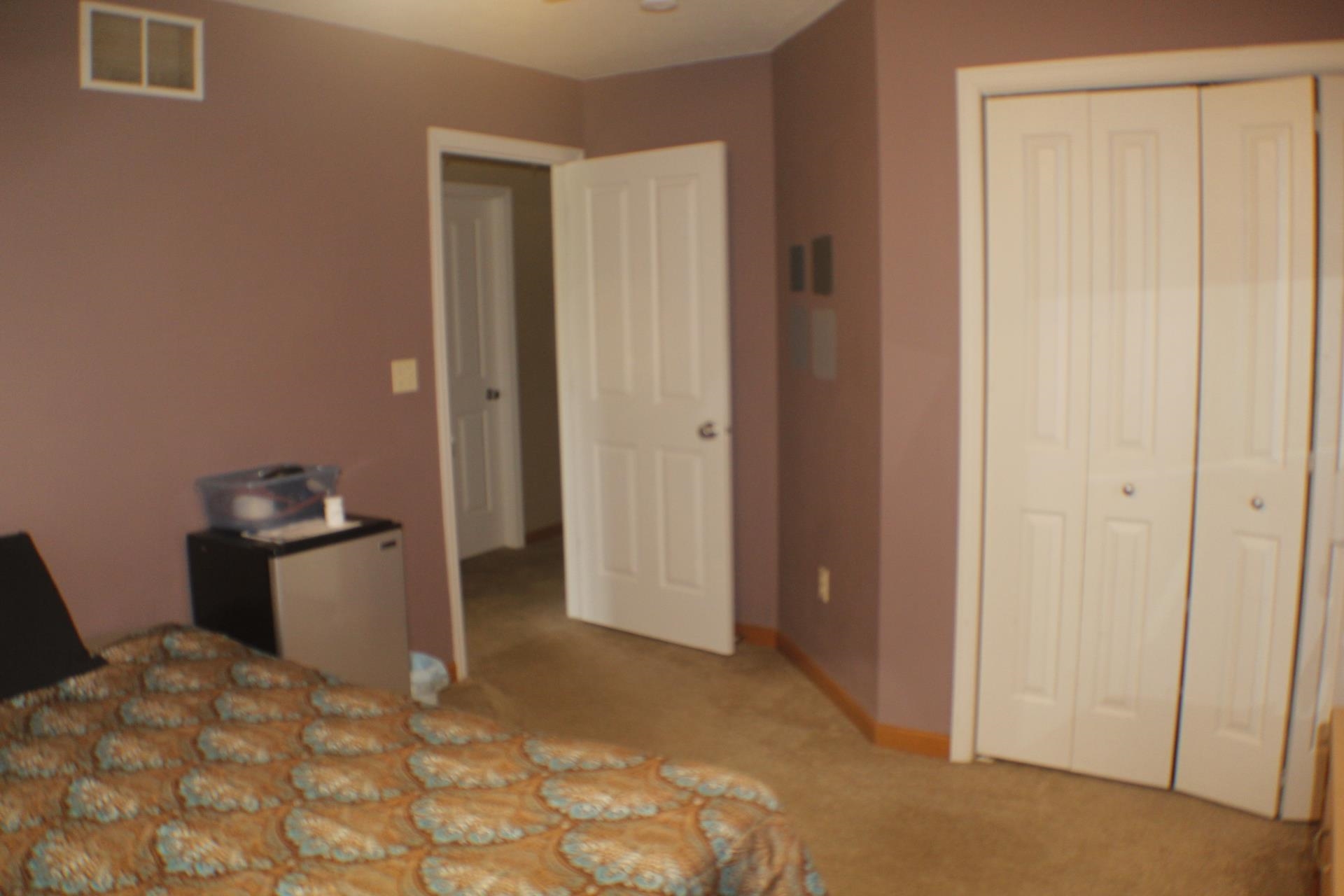 9190 North Barker Road Byron, IL 61010 - Photo 26 of 53 a view of a bedroom with closet