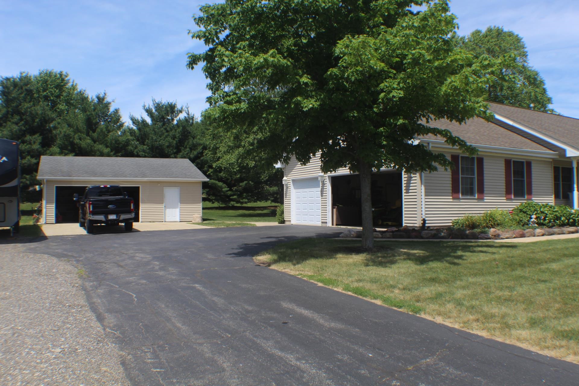9190 North Barker Road Byron, IL 61010 - Photo 3 of 53 a view of a house with pool and a yard