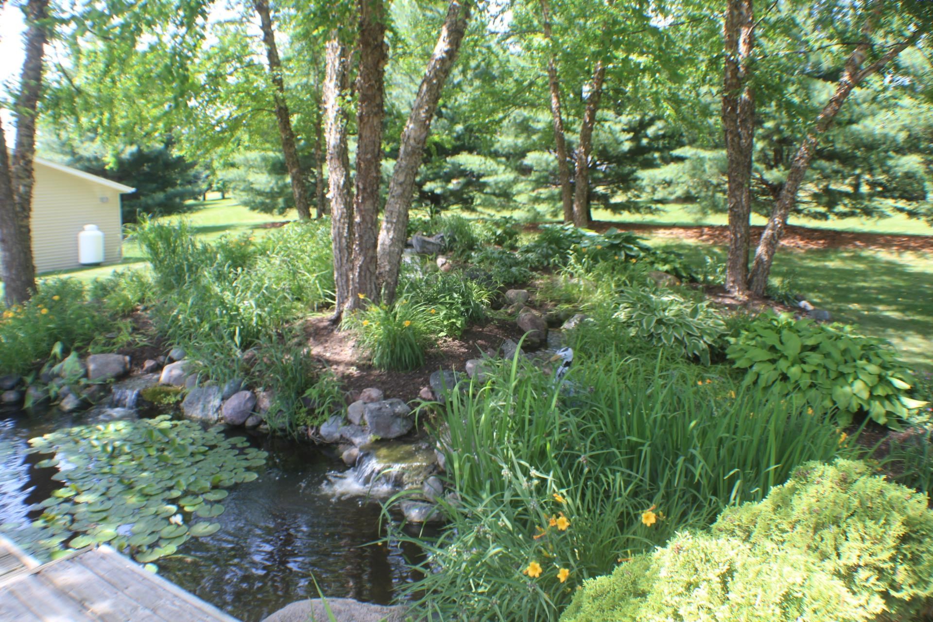 9190 North Barker Road Byron, IL 61010 - Photo 50 of 53 a backyard of a house with lots of green space