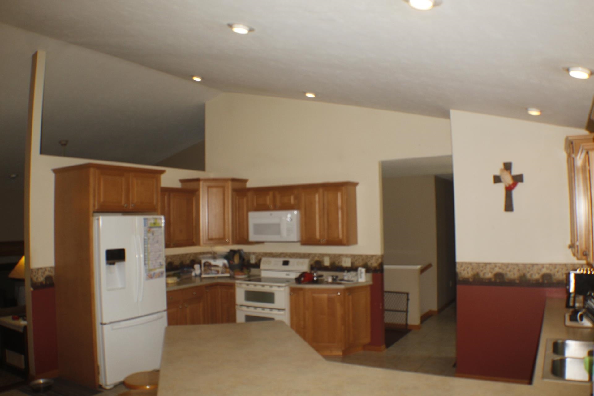 9190 North Barker Road Byron, IL 61010 - Photo 6 of 53 a kitchen with stainless steel appliances granite countertop a refrigerator stove and oven