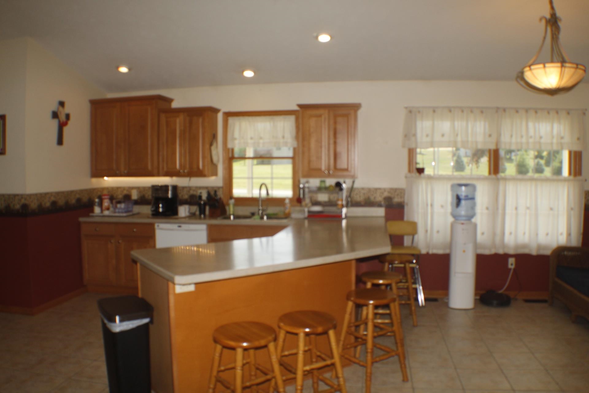 9190 North Barker Road Byron, IL 61010 - Photo 8 of 53 a large kitchen with granite countertop lots of counter space and windows