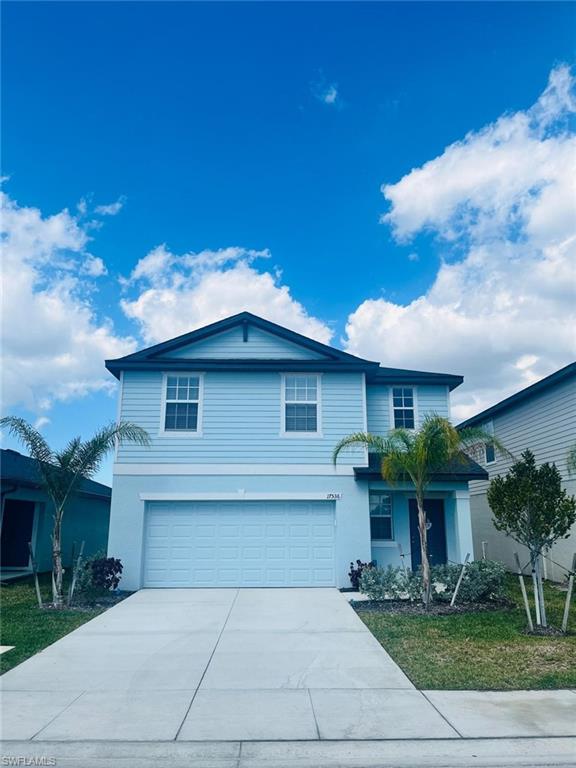 17536 Monte Isola Way North Fort Myers, FL 33917 - Photo 2 of 19 a front view of a house with garden