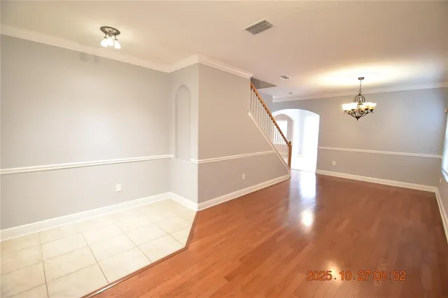 a view of a room with window and wooden floor