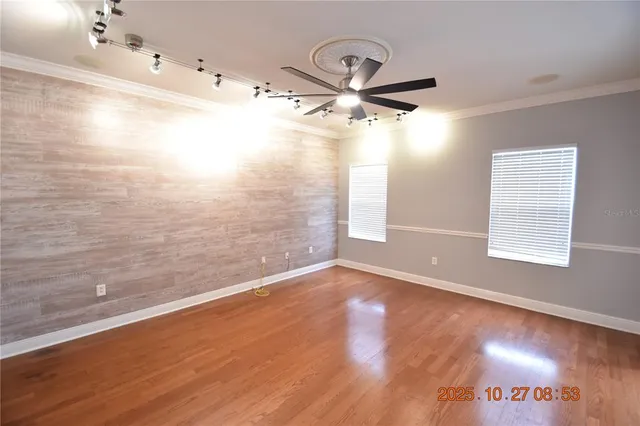 a view of a room with wooden floor