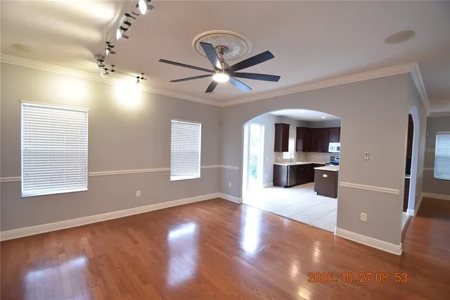 a kitchen with stainless steel appliances a refrigerator and a stove top oven