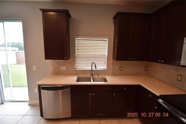 a view of a room with an empty space and a window