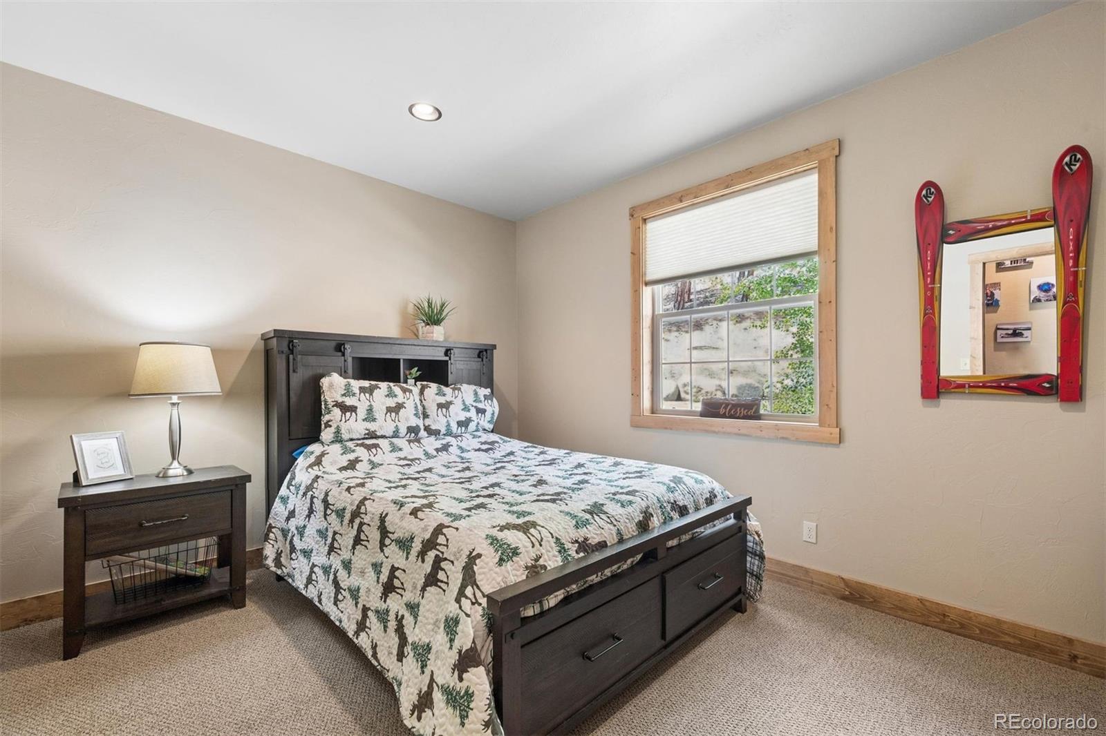 2894 County Road 43 Bailey, CO 80421 - Photo 17 of 40 a bedroom with a bed and a window