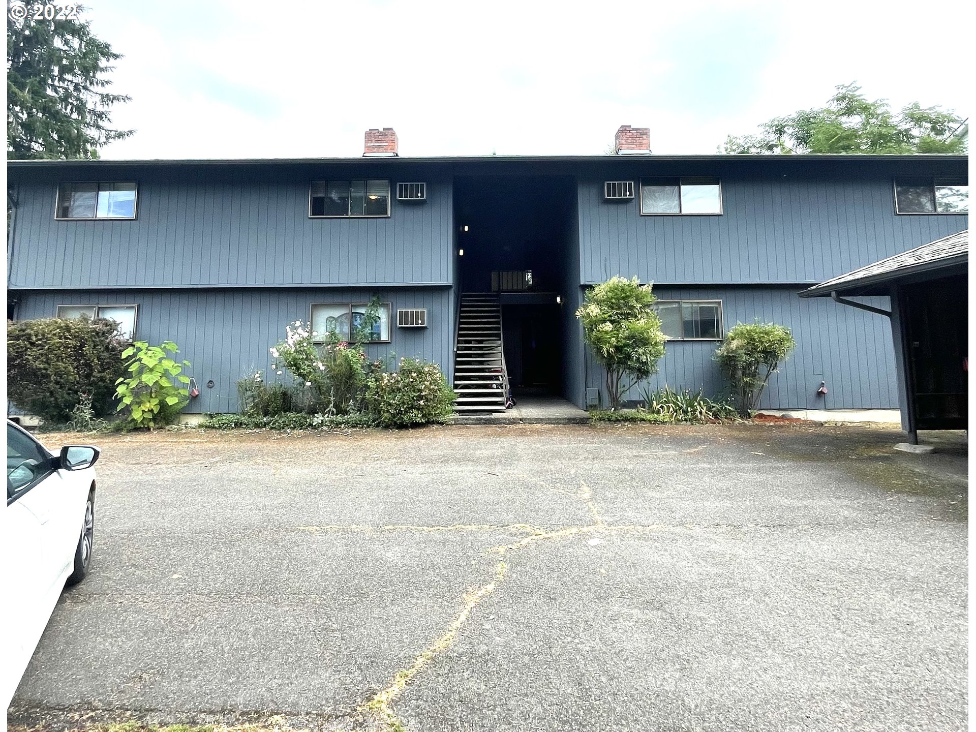 8960 Southwest Cashmur Lane Portland, OR 97225 - Photo 1 of 19 a front view of a house with a yard and garage