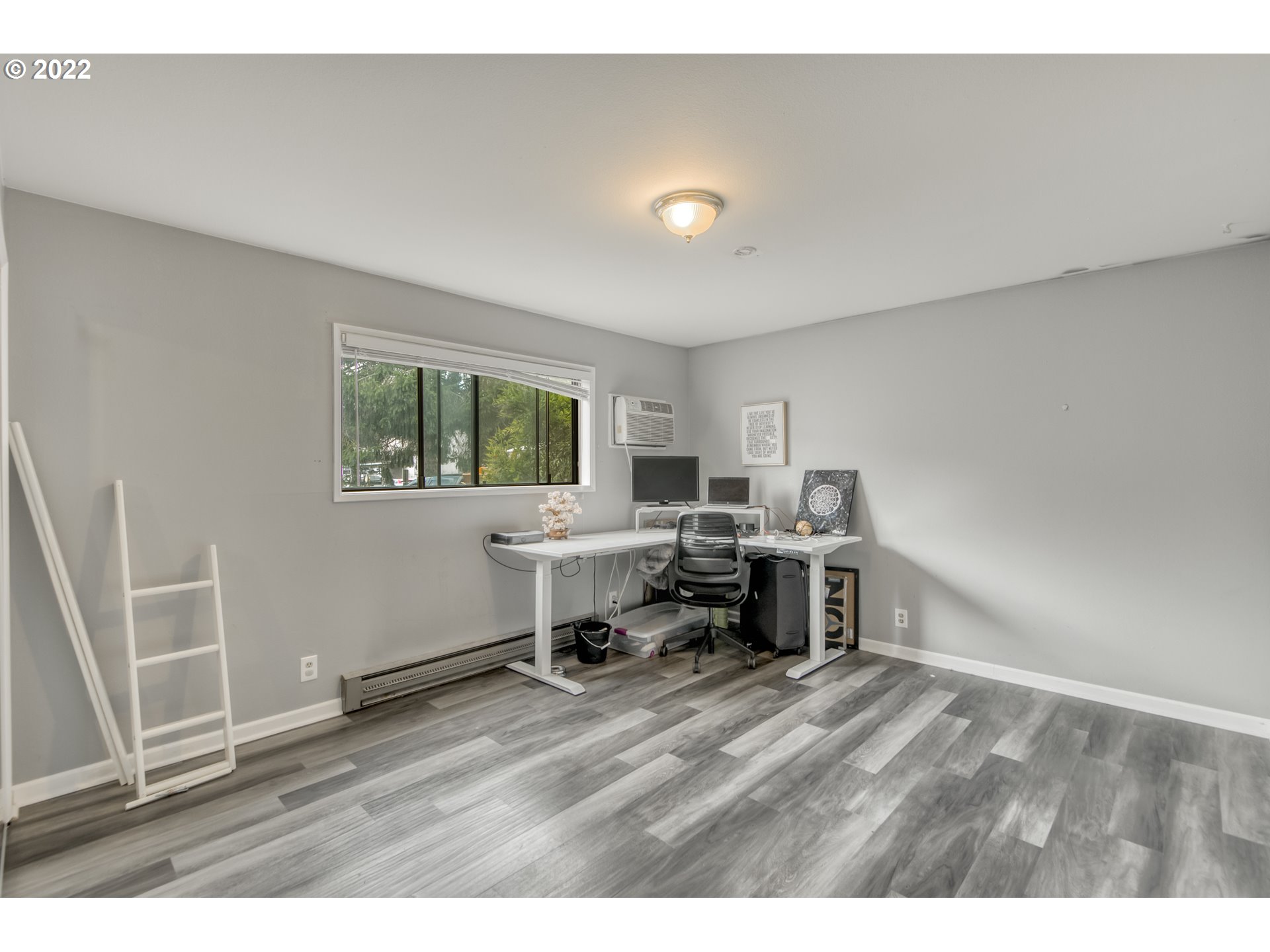 8960 Southwest Cashmur Lane Portland, OR 97225 - Photo 13 of 19 a view of a workspace with furniture and a window