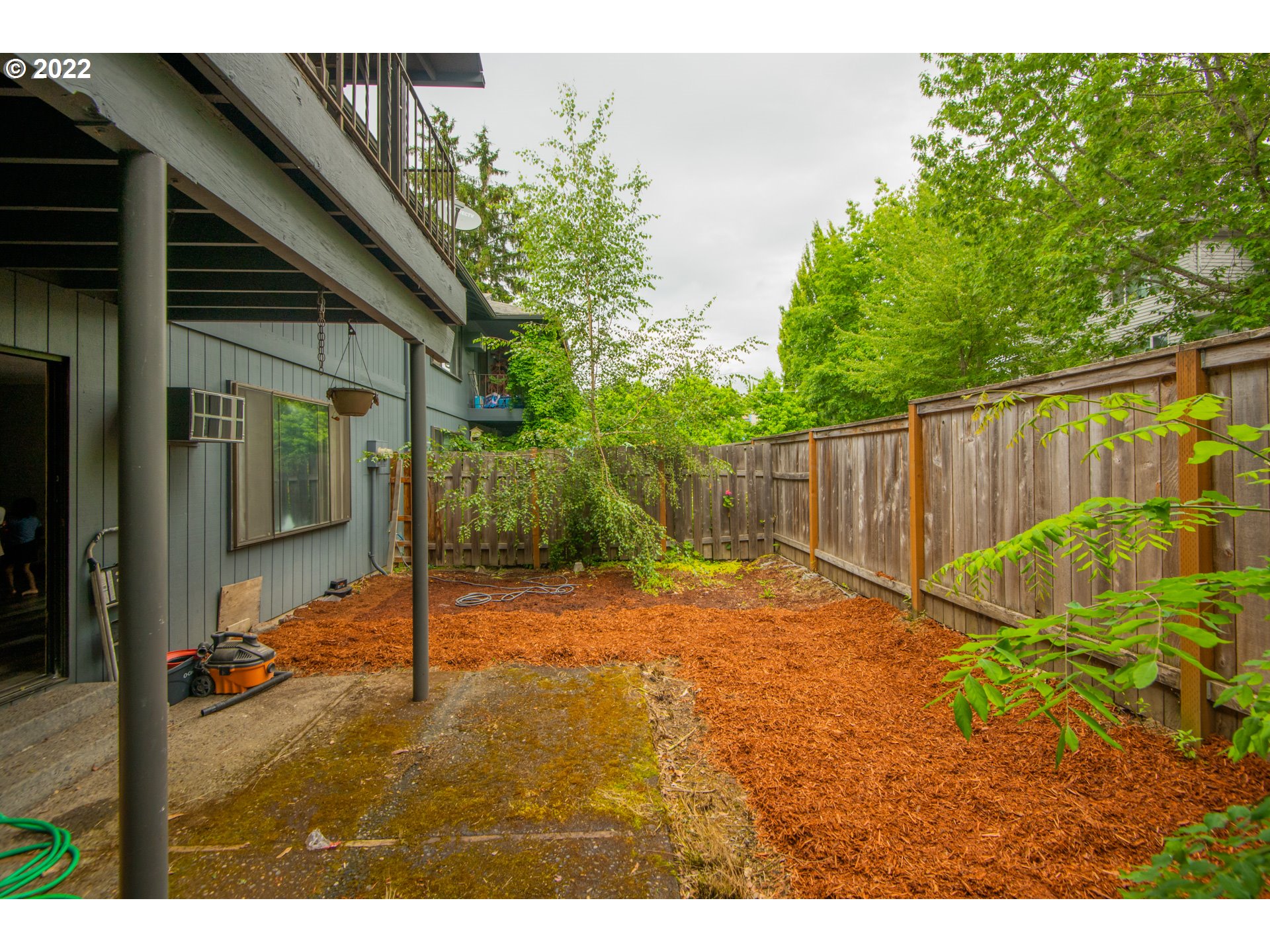 8960 Southwest Cashmur Lane Portland, OR 97225 - Photo 16 of 19 a backyard of a house with lots of green space