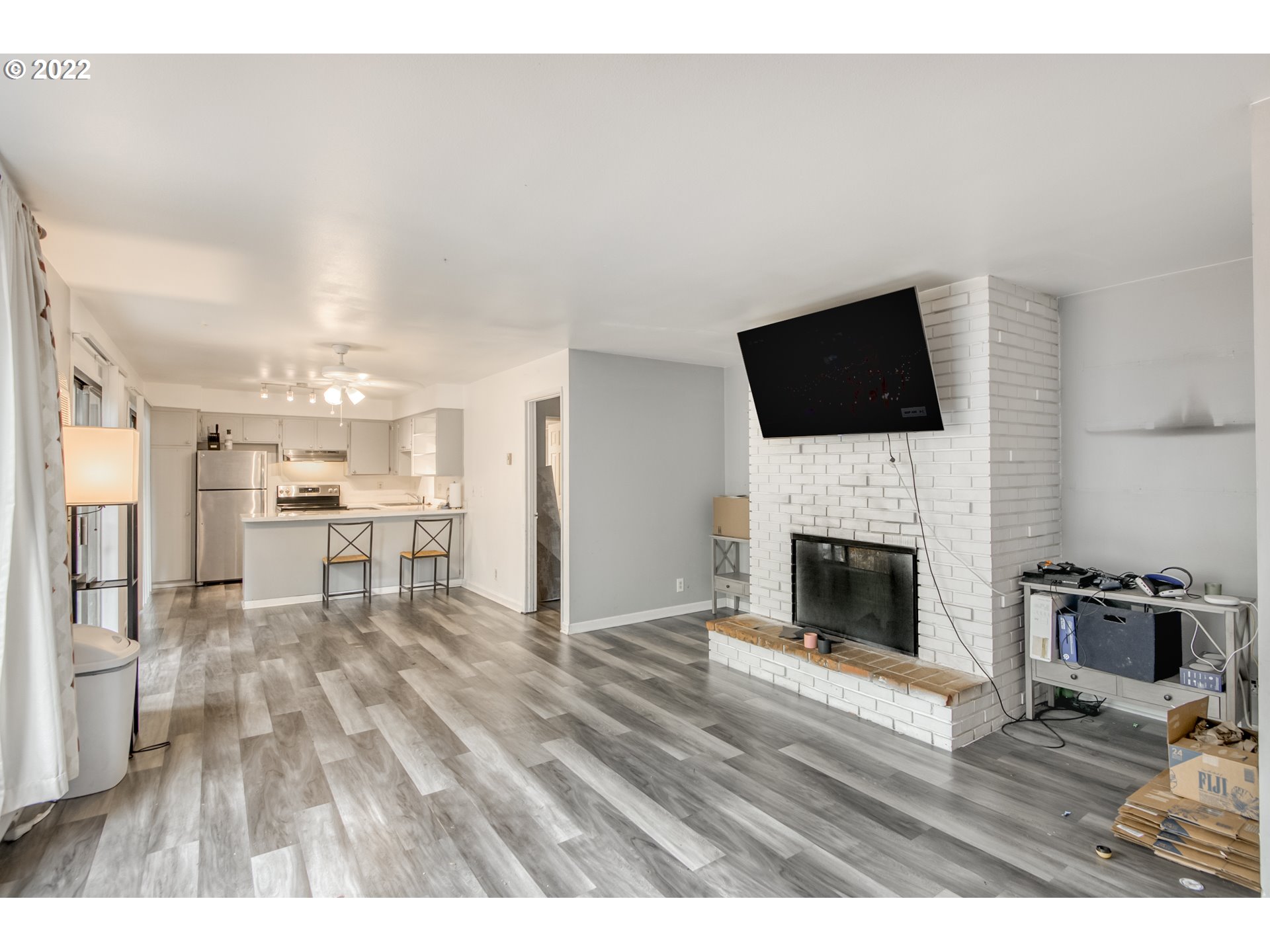 8960 Southwest Cashmur Lane Portland, OR 97225 - Photo 3 of 19 a living room with furniture and a fireplace